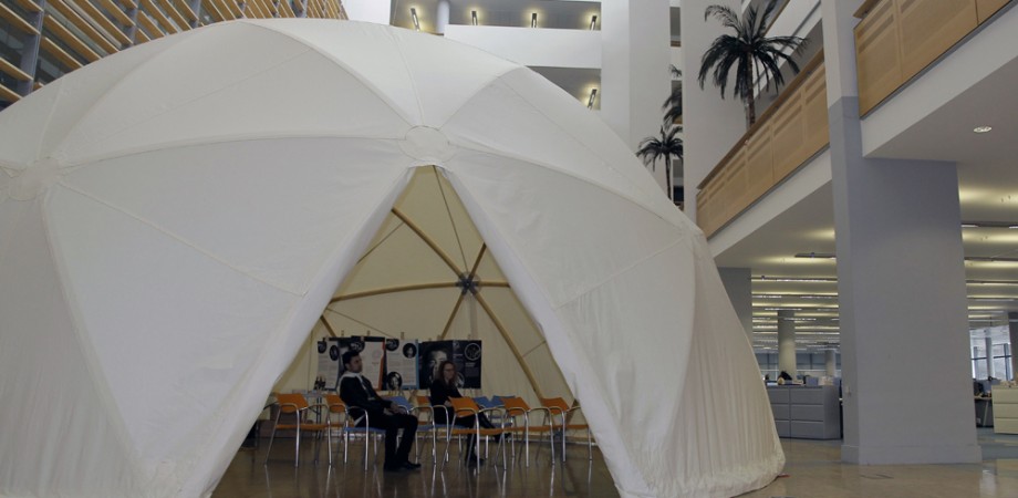 People sat inside a covered Dome structure