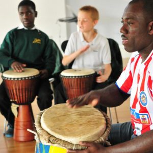 School children participate in drum workshop