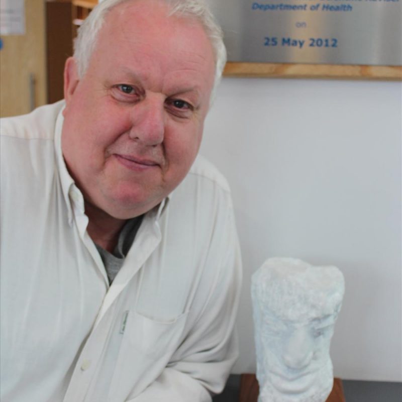 Paul poses with his sculpture