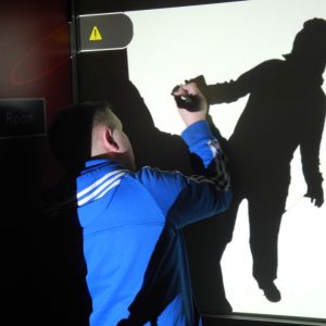 Silhouette of child being painted on wall