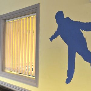 Silhouette of child painted on wall