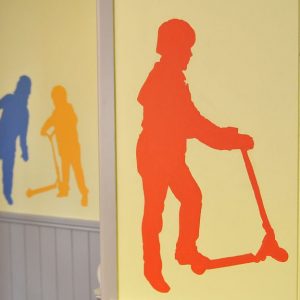 Silhouette of child painted on wall