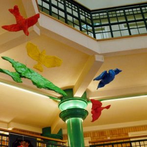 Painted model birds suspended in Gedling Civic Centre Atrium