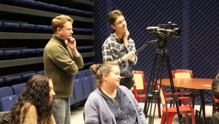 Two people film event