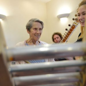 Older person plays chimes
