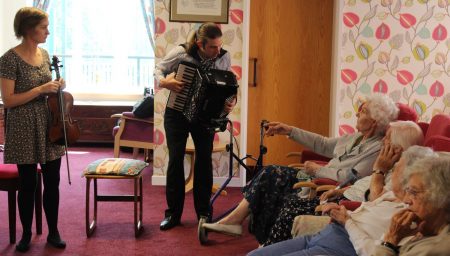 Musicians play for the elderly