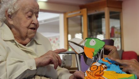 Care home resident meets bird puppets