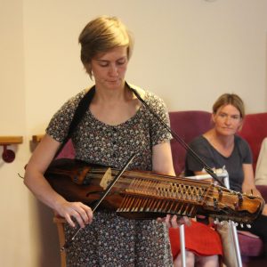 Musician play for elderly care home residents