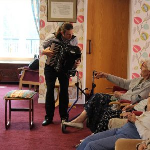 Care home residents enjoy musical performance