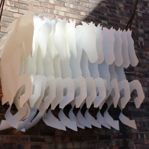 Suspended paper sculpture of horses