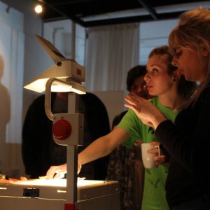 Woman puts puppets on overhead projector