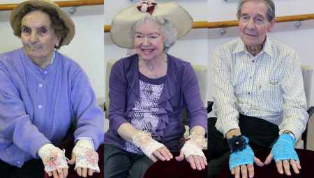 Older people wearing lace gloves
