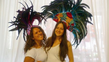 Volunteers model headdresses