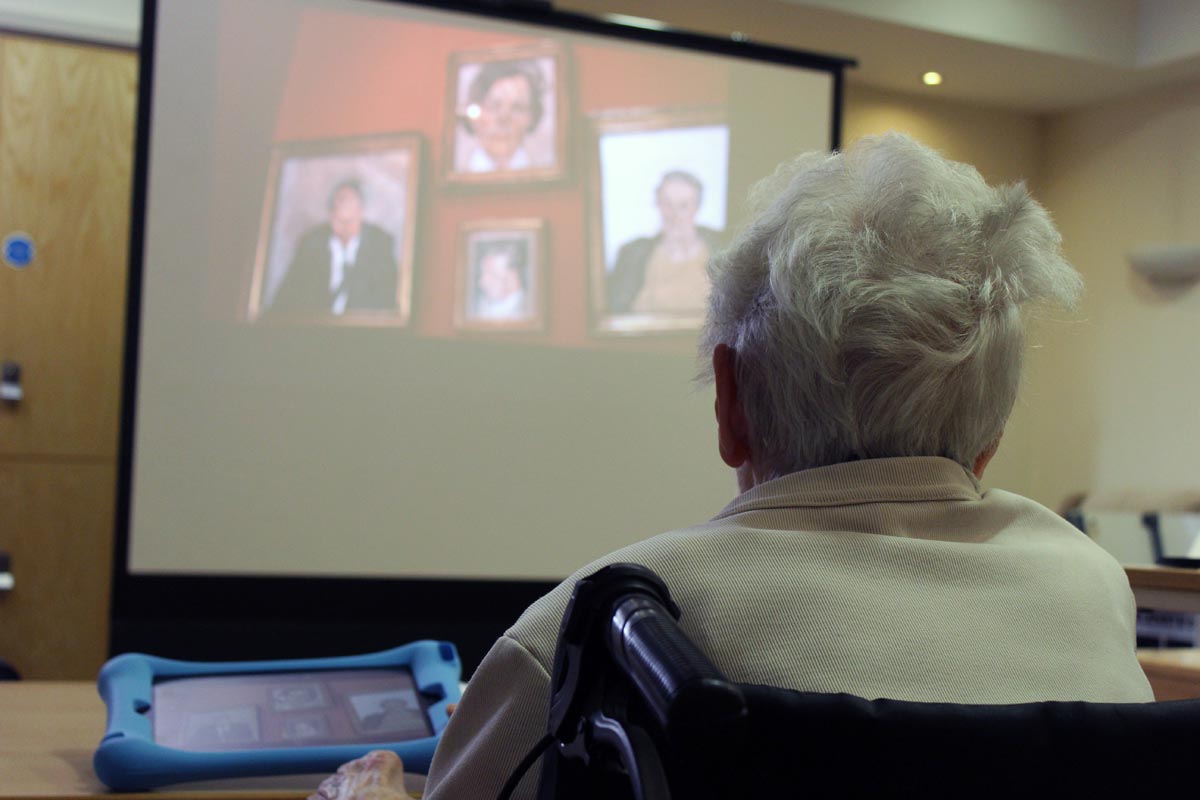 Older person watches film