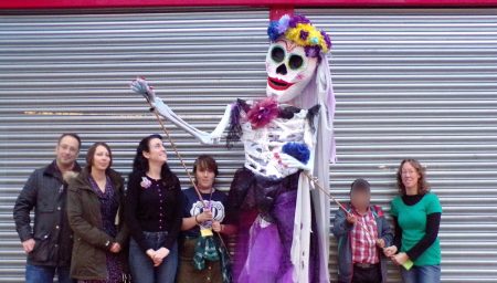 Young people and giant 'Day of the Dead' puppet