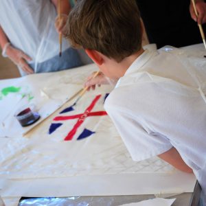 School children painting silk
