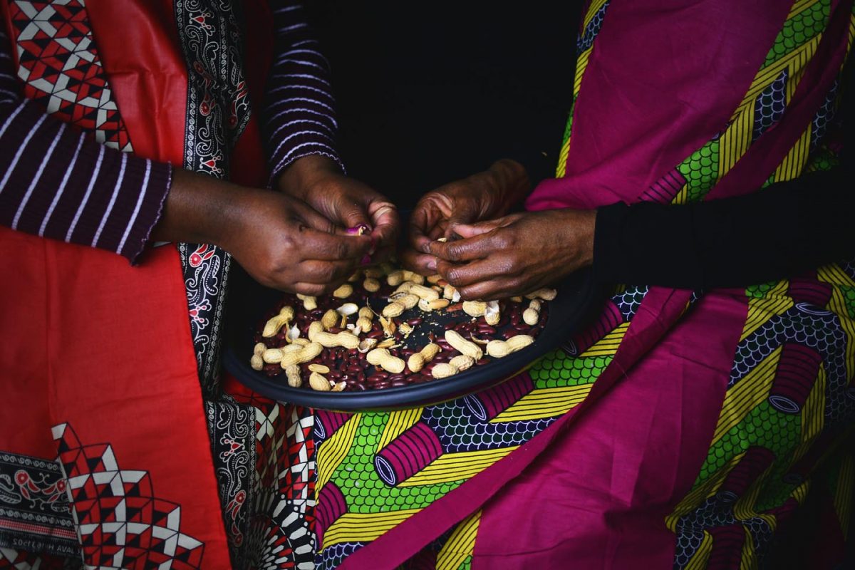 Art photo of women shelling nuts