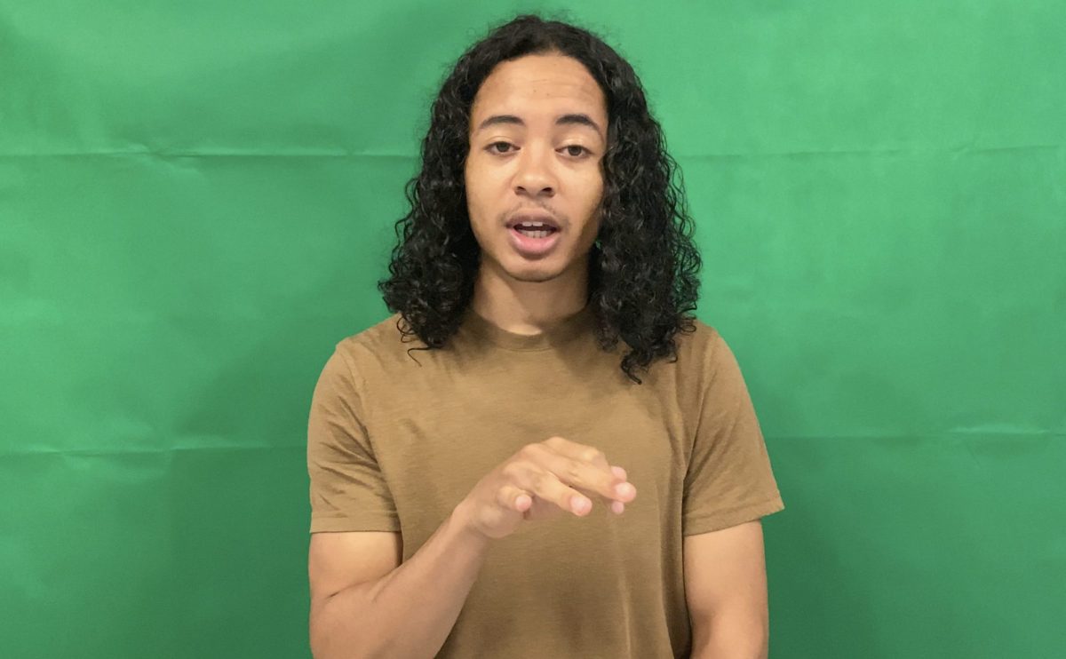 Young poet performing in front of a green screen