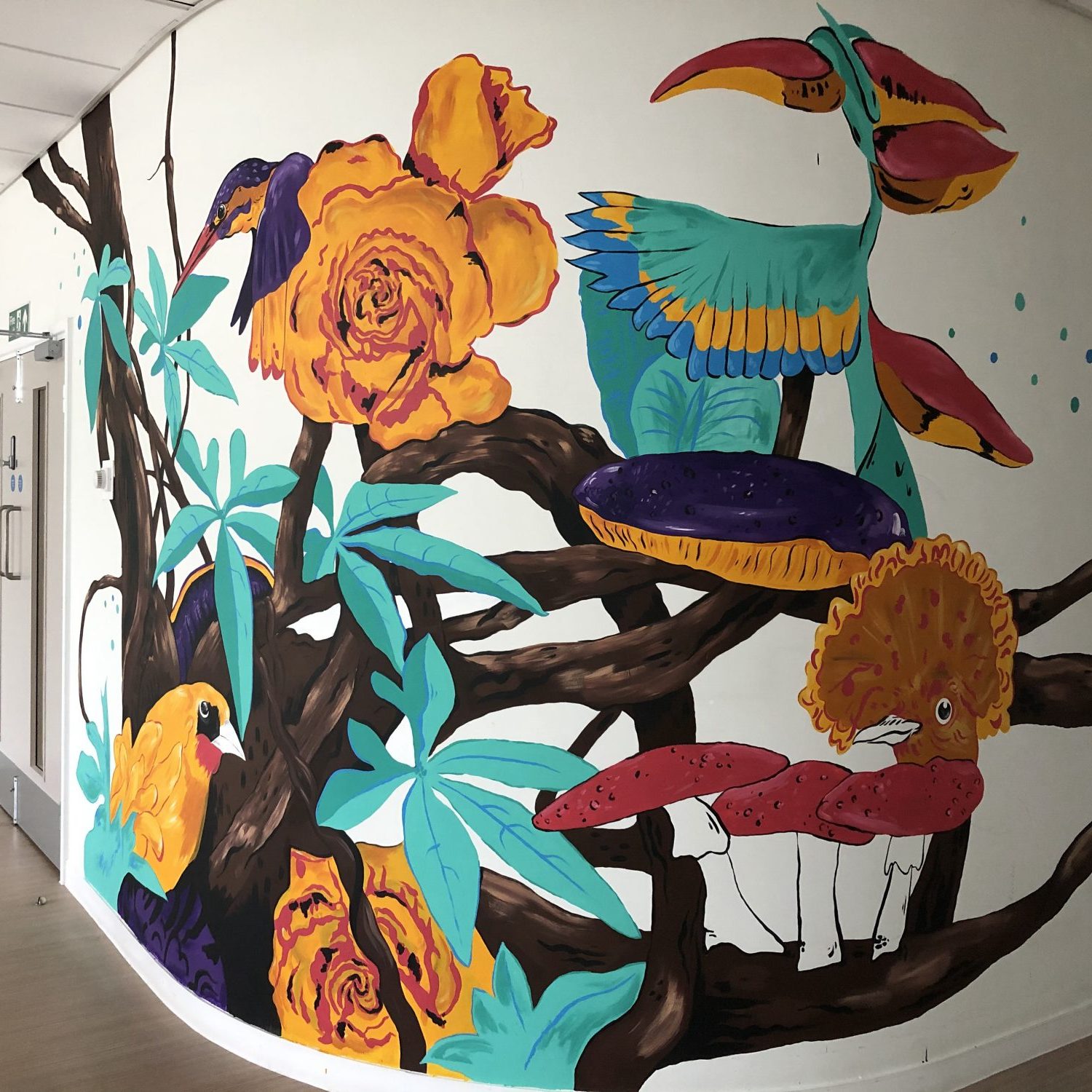 A mural featuring birds, flowers branches and mushrooms