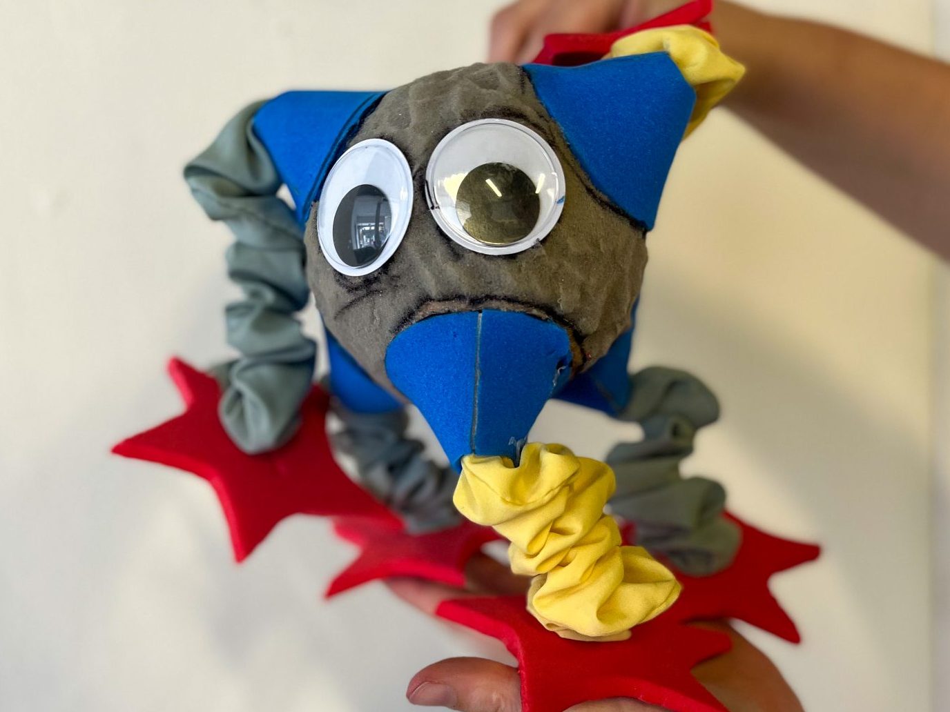 Puppet with large goggley eyes