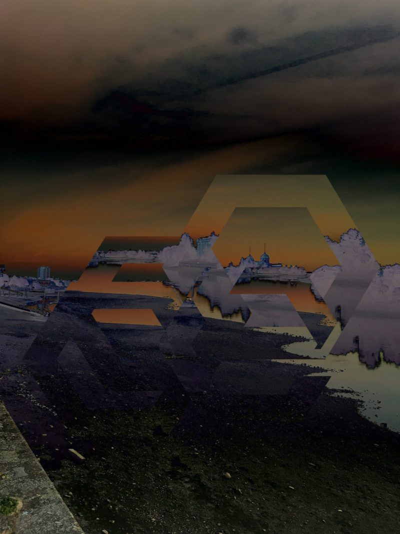 The digitised image depicts a landscape of a city, the ground at the forefront of the image is dark, while the sky is sunset of orange, blues and dark grey. You can make out building in the distance of the landscape, but it is disrupted but two pentagons in the center of the image which magnify the overlaps of the picture