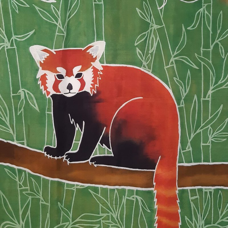 Silk painting of a red panda on a branch