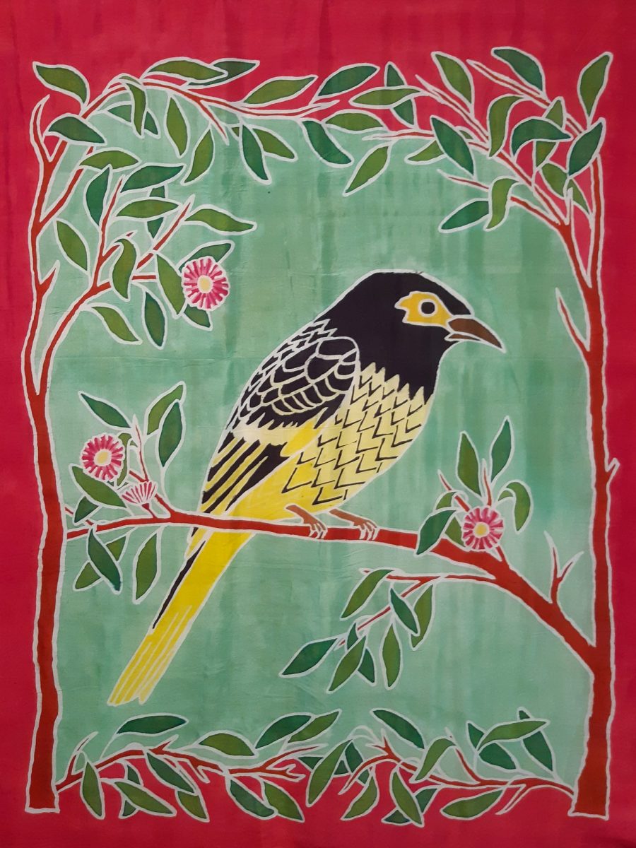 Silk painting of a bird sitting on a branch
