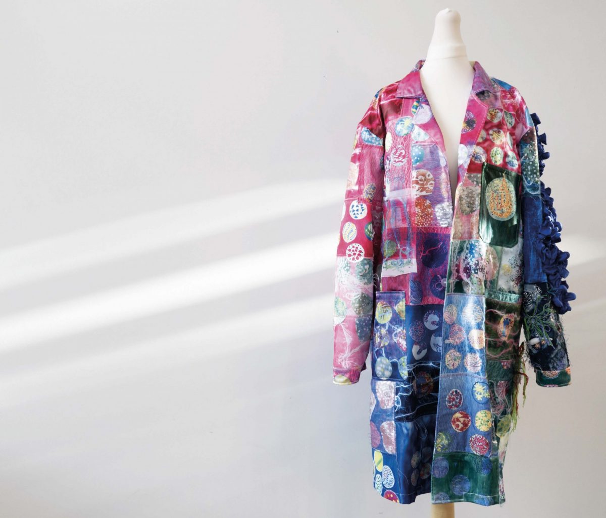 Brightly coloured patchwork labcoat