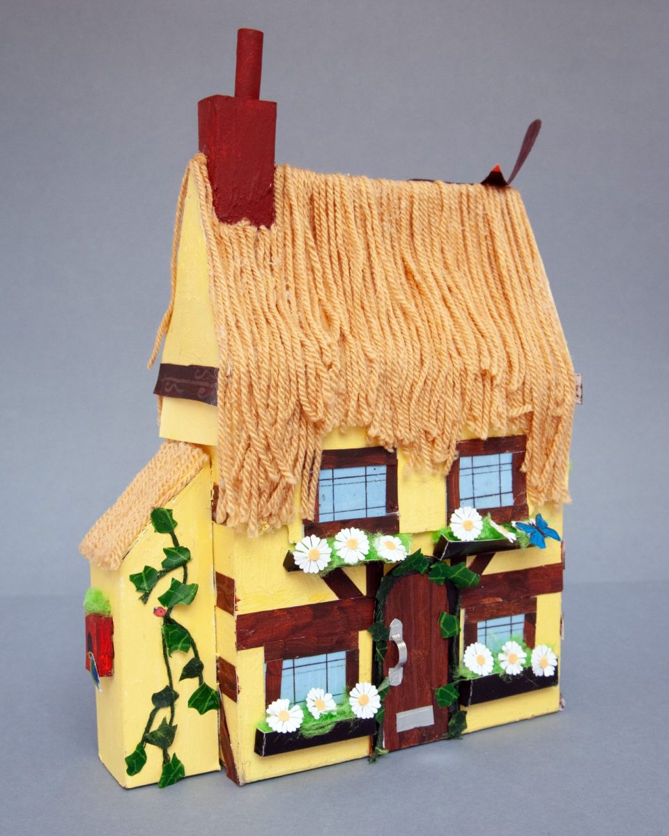 Paper and textile model of a thatched cottage