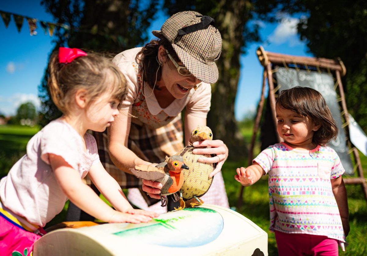 HandMade Theatre performer show  bird puppets to two children