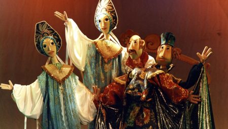 GPT Elaborately dressed marionette puppets posed on a stage, with detailed costumes and expressive faces.
