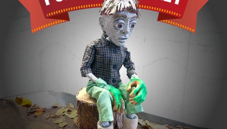 A handmade puppet with a paper-maché face, grey hair and green hands sits on a small tree-stump prop, surrounded by scattered leaves on the floor. Above the puppet is a red ribbon banner with the words: ‘CITY ARTS PRESENT… PUPPET CABARET’. At the bottom of the image, white text reads: ‘7PM, 27 NOVEMBER 2025. CITY ARTS, 11–13 HOCKLEY, NG1 1FH. BOOK VIA CITY-ARTS.ORG.UK/WHATS-ON’.