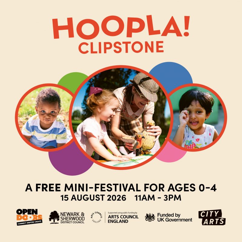 Poster for Hoopla! Clipstone, a free mini-festival for children aged 0–4. At the top, ‘HOOPLA! CLIPSTONE’ appears in bold orange text above three circular photos: a child crawling on grass, a performer helping a young child explore bird puppets, and a smiling child. The festival takes place on 15 August 2026 from 11am–3pm. Logos for Open Doors, Newark and Sherwood District Council, Arts Council England, the UK Government and City Arts appear along the bottom.